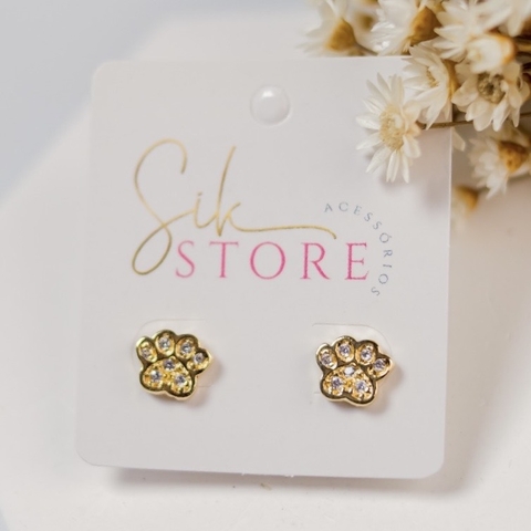 Brinco Patinha de Cachorro Cravejada - comprar online