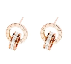 Aretes reloj con zirconias rosas