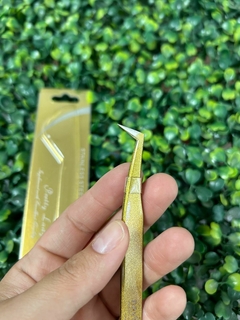 Pinza "NAVINA" en L, dorada - comprar online