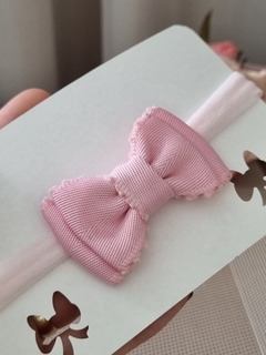 Faixa para recém-nascido com laço rosa em tecido sarja