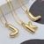 COLAR VENEZIANA PINGENTE INICIAL LETRA L BANHADO A OURO - comprar online