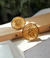Aretes bronce con baño en oro en internet