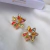 Brinco flor g zircônia collor Banhado à Ouro 18K
