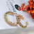 Brinco Argola Torcida cravejada Banhado a Ouro 18K