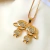Colar dois meninos cravejados Banhado a Ouro 18K - comprar online