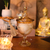 Vela Aromática Lima e Flor de Laranjeira em Vidro Dourado