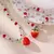 Imagen de Conjunto de joyas de fresita (collar + aretes)