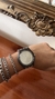 Reloj metálico tejido
