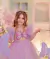 Vestido de festa infantil rosa/lilás com borboleta bordada no peito.