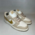Dunk Low “Gold Swoosh”