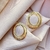 Brinco Minimalista Oval Vazado Banho de Ouro 18k - comprar online