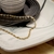 CHOKER CORRENTE MALHA TORCIDA OURO