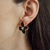 ARETES FLOR NEGRA - d´luna joyeria