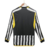 Camisa de futebol masculina da Juventus 23/24, com design preto e branco, vista traseira.