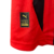 Detalhe da etiqueta da camisa Home Milan 24/25, mostrando o logo da Puma e a autenticidade do produto.