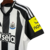 Camisa_Home_Newcastle_24-25_-_Torcedor_Adidas_Masculina_-_Preto1-removebg-preview