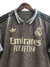 Camisa cinza do Real Madrid terceira edição 24/25 masculina da Adidas, com logo Emirates Fly Better e detalhes em preto e branco
