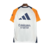 Camisa de treino do Real Madrid para torcedores, modelo masculino, nas cores branca e laranja.