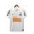Camisa retrô do Santos Futebol Clube, branca, com detalhes em preto e logotipos de patrocinadores.