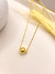 Colar esfera Manu dourado na internet