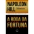 Capa do livro "A Roda da Fortuna" de Napoleon Hill com fundo degradê laranja e preto e título em letras grandes