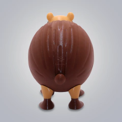 Figura coleccionable Cococini Burbaloni Luliloli vista desde atrás mostrando su forma redonda y detalles en marrón y beige