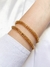 PULSEIRA DOURADA COM DETALHES VAZADO LIBERDADE