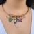 Colar Aro Tucano Azul, Ajustável em cravação manual e banhado a ouro 18k. - comprar online