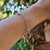 Pulseira feminina 4 Pingentes Olho Grego - comprar online
