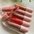 Gloss Labial Radiant Kiss Ruby Rose – Brilho Intenso e Efeito Espelhado - comprar online
