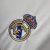 Imagem do Camisa Real de Madrid I 25/26 - Torcedor Adidas Masculina - Branca com detalhes em cinza e amarelo