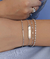 PULSEIRA COM MINI MEDALHAS DE CORAÇÃO NO RÓDIO - comprar online