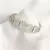 Bracelete de aço inox, círculos com strass e círculos vazados.