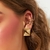 Piercing de orelha com zircônias banhado a ouro - comprar online