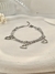 Pulseira Tripla Corações em Aço Inoxidável Prata - comprar online