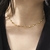 Choker Corações 3D Em Aço Inoxidável Dourado na internet