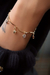Pulseira pingentes estrelas e pontos de luz