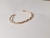 PULSEIRA BRACELETE ABERTO TUBULAR TORCIDO - comprar online