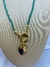 Imagem do COLAR ELO CRISTAIS VERDE PINGENTE DENTE DE SABRE PRETO ZIRCONIA VERMELHA SAO BENTO E PONTO DE LUZ CRISTAL