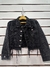Campera negra nevada