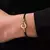 Pulseira Ferradura Minimalista em Ouro 14K - loja online