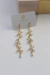 Brinco cascata de zircônia banho de ouro 18k