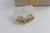 Brinco meia concha cravejado banho de ouro 18k