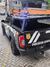 Capota Torden Adventure instalada em uma Nissan Frontier 2024, veículo da polícia civil com detalhes visíveis, como por exemplo: as portas abertas, o Rach de teto ja instalado, os amortecedores da portas que as man tem abertas e auxilia no fechamento.