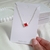 Pulseira Trevo Vermelho Detalhado na internet