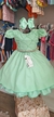 Vestido infantil verde com nervura e perolas no peito
