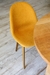 Silla Nina tapizada con patas de madera en internet