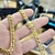 Corrente Grumet 7mm Com Pingente Cruz Relevo M Banhados A Ouro 18k - comprar online