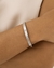Bracelete Unissex Cravejado com Gravações em Aço Inox na internet