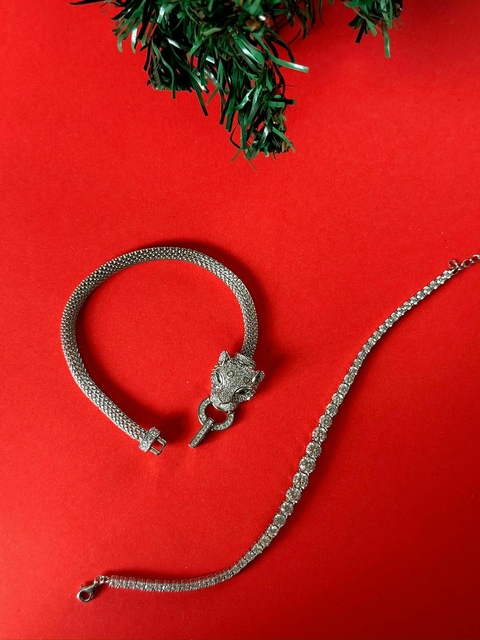 Pulsera tejida en plata rodinada con piedra cubic con cierre cabeza de puma y ojos en esmeraldinas